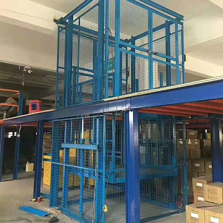 巨力定制固定導(dǎo)軌式升降平臺車間廠房物流貨物提升機液壓升降貨梯